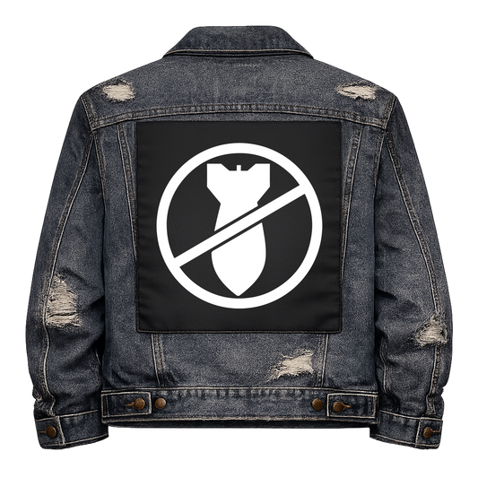 Black fabric back patch sew onto a denim jacket with the design "No Bombs"