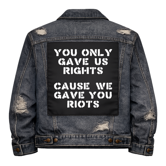 Black fabric back patch sew onto a denim jacket with the design "We Gave You Riots"