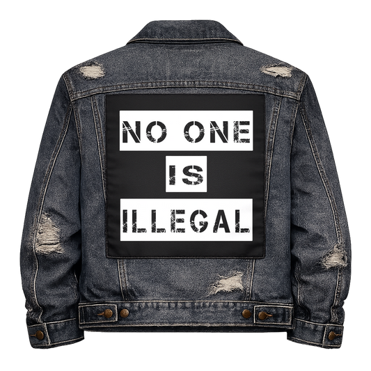Black fabric back patch sew onto a denim jacket with the design "No One is Illegal"