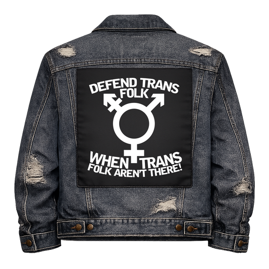 Black fabric back patch sew onto a denim jacket with the design "Defend Trans Folk"