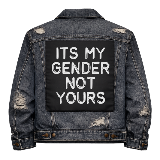 Black fabric back patch sew onto a denim jacket with the design "It's My Gender Not Yours"