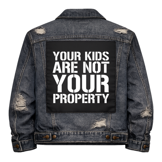 Black fabric back patch sew onto a denim jacket with the design "Kids are not your Property"