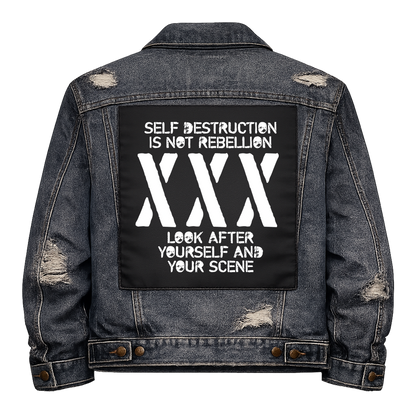 Black fabric back patch sew onto a denim jacket with the design "Self Destruction"