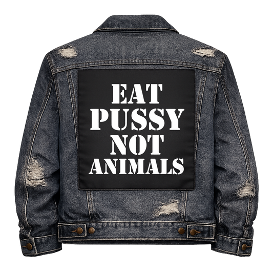 Black fabric back patch sew onto a denim jacket with the design "Eat Pussy, Not Animals"