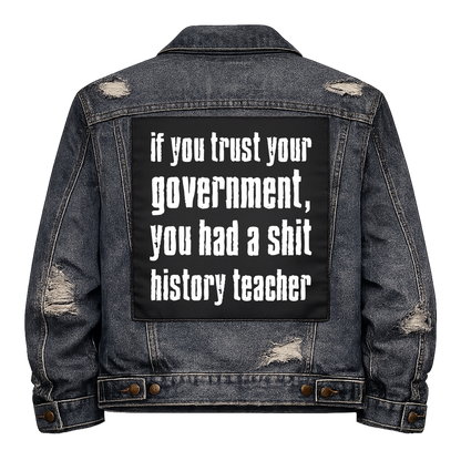 Black fabric back patch sew onto a denim jacket with the design "Shit history Teachers"