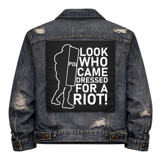 Black fabric back patch sew onto a denim jacket with the design "Dressed for a Riot"