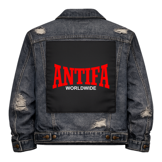 Antifa Worldwide Full Colour Back Patch shown on the back of a distressed denim jacket: red college-style ANTIFA lettering with WORLDWIDE in white underneath, reading "ANTIFA WORLDWIDE"
