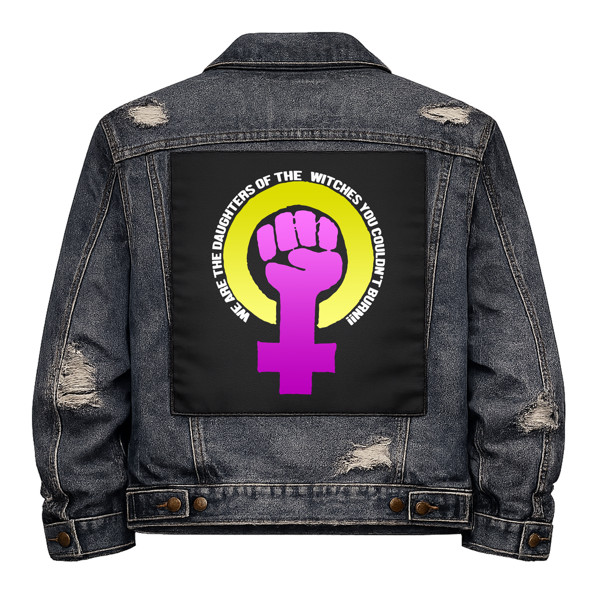 Daughters of Witches Full Colour Back Patch shown on the back of a distressed denim jacket: purple raised fist in a Venus symbol inside a yellow ring, with the slogan curved around it, reading "WE ARE THE DAUGHTERS OF THE WITCHES YOU COULDN'T BURN!"