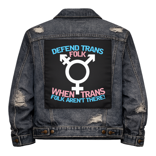 Defend Trans Folk Full Colour Back Patch shown on the back of a distressed denim jacket: trans symbol between lines of trans flag coloured lettering, reading "DEFEND TRANS FOLK WHEN TRANS FOLK AREN'T THERE!"
