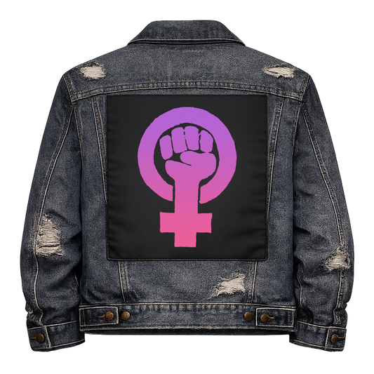 Feminist Fist Full Colour Back Patch shown on the back of a distressed denim jacket: raised fist inside a female symbol in a purple to pink gradient