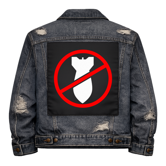 No Bombs Full Colour Back Patch shown on the back of a distressed denim jacket: white bomb inside a red no symbol