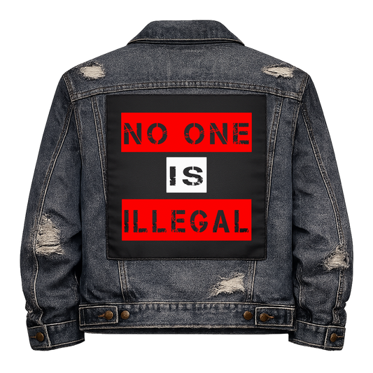 No One Is Illegal Full Colour Back Patch shown on the back of a distressed denim jacket: red and white stencil panels, reading "NO ONE IS ILLEGAL"