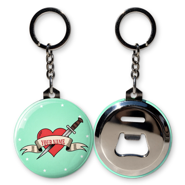 One-off custom bottle opener keyring printed with a tattoo heart and dagger reading Your Name, shown with the bottle opener back, chain and split ring