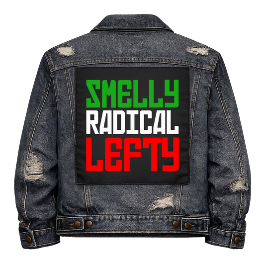 Smelly Radical Lefty Full Colour Back Patch shown on the back of a distressed denim jacket: green, white and red rounded capitals, reading "SMELLY RADICAL LEFTY"